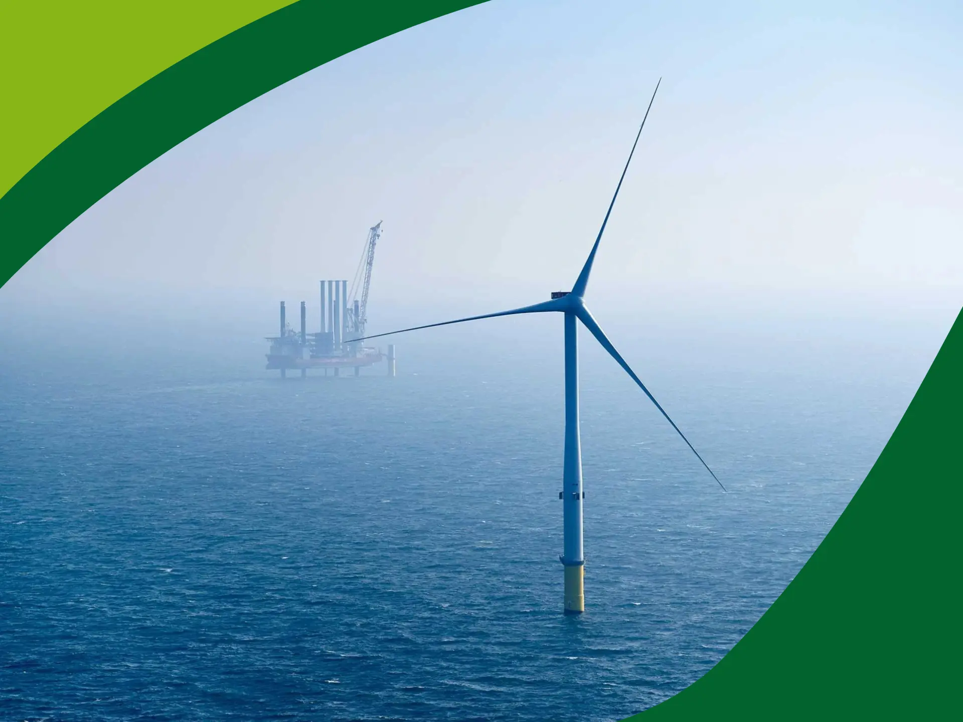 Vindmøller foran boreplatform